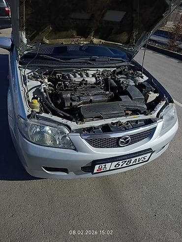 Унаа: Mazda 323: 2001 г., 1.6 л, Кол менен иштөөчү, Бензин, Хетчбек — 9