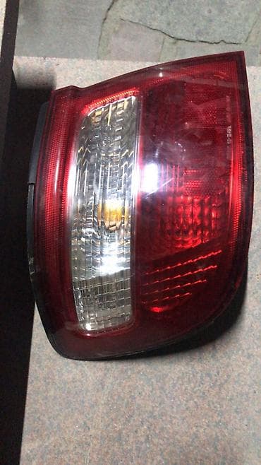 Системы освещения: Левый поворотник Nissan 1998 г., Б/у, Оригинал — 1
