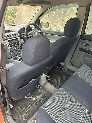 Унаа: Mazda Demio: 2003 г., 1.5 л, Кол менен иштөөчү, Бензин, Хетчбек — 10