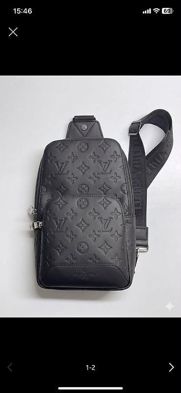 Жеке буюмдар: Барсетка Louis Vuitton, черный цвет. Стоимость: 3400 сом. - Материал — 2