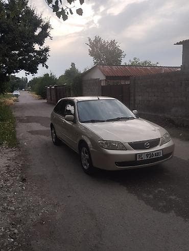 e2 byd: Mazda 323: 2002 г., 1.6 л, Механика, Бензин, Хэтчбэк — 7