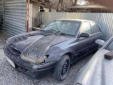 стартер авто: Автомобиль седан темно‑серого цвета, ориентировочно середины–конца — 1