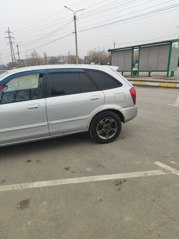 Ламинат: Mazda 323: 2002 г., 1.5 л, Автомат, Бензин, Универсал — 4