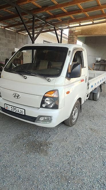 аднаскат портер: Hyundai Porter II, бортовой грузовик белого цвета. Компактный — 3