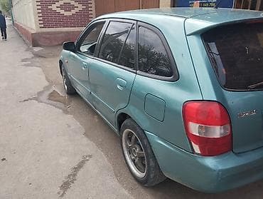 бир: Mazda 323: 2002 г., Кол менен иштөөчү, Бензин, Хетчбек — 2