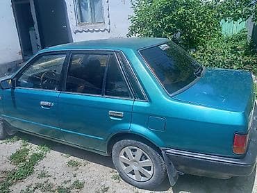 Унаа сатуу: Mazda 323: 1986 г., 1.5 л, Кол менен иштөөчү, Бензин, Седан — 2