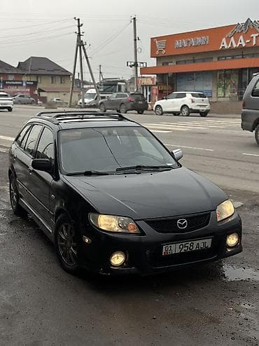 Mazda 323: 2003 г., 2 л, Типтроник, Бензин, Хэтчбэк
