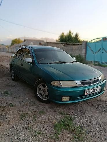 авто лейлек: Mazda Familia: 1997 г., 1.6 л, Автомат, Бензин, Седан — 3