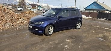 Mazda Demio (1‑е поколение, рестайлинг) — компактный 5‑дверный хэтчбек