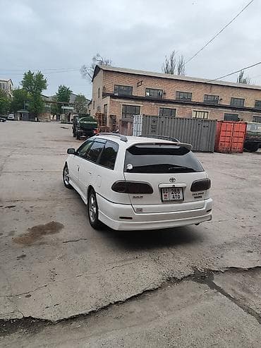 corolla e150: Универсал белого цвета, правый руль. Просторный кузов с большим — 4