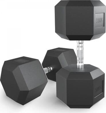гантели для начинающих дома: Пара черных гантелей весом 50 кг каждая. Гантели имеют многогранную — 1