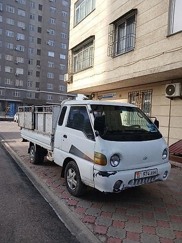 Чарбалык товарлар: Буйрутма берүү Хендай портер, Курулуш таштандыларын чыгаруу, Жүк ташуучу жумушчусу менен — 1