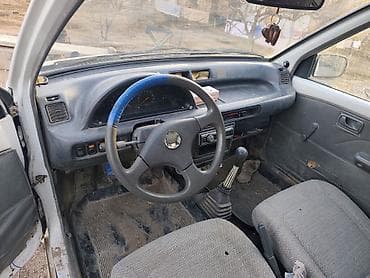 Унаа: Daihatsu Cuore: 1994 г., Кол менен иштөөчү, Бензин, Хетчбек — 1
