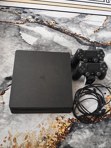 PlayStation 4 Slim (черная) Комплектация: - консоль PS4 Slim - 2 lalafo.kg да PlayStation 4 Slim (черная) Комплектация: - консоль PS4 Slim - 2
