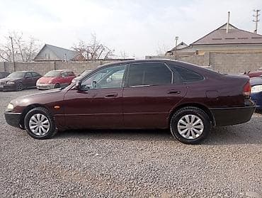 mazda kapella: Mazda Cronos: 1993 г., 1.8 л, Механика, Бензин, Седан — 1