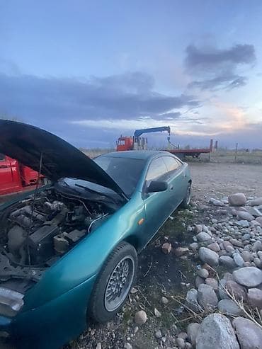 купить запчасти на опель вектра б: Mazda 323: 1995 г., 1.5 л, Механика, Бензин, Лифтбек — 4