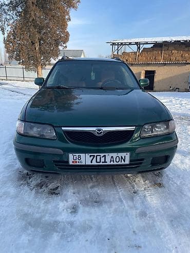 наклейки для авто: Mazda 626: 1998 г., 2 л, Механика, Универсал — 3