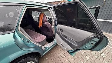 Mazda 323: 2003 г., 1.6 л, Автомат, Бензин, Универсал