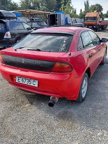 тканевый: Mazda Lantis: 1997 г., 1.5 л, Механика, Бензин, Хэтчбэк — 3