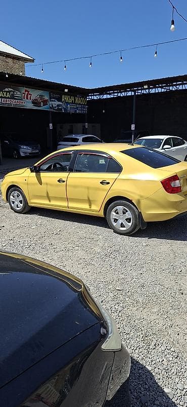 авто стенд: Skoda Rapid: 2015 г., 0.6 л, Механика, Бензин, Седан — 3