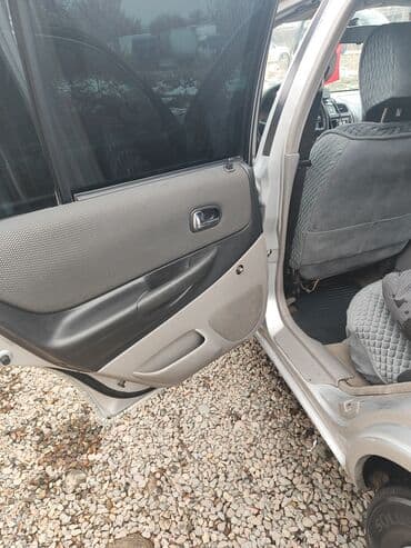 Ламинат: Mazda 323: 2002 г., 1.5 л, Автомат, Бензин, Универсал — 9