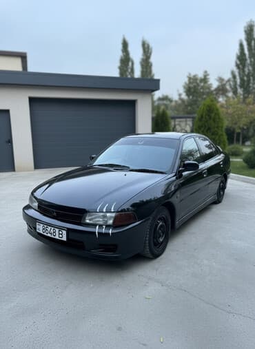 дом обмен на авто: Mitsubishi Lancer: 1997 г., 1.5 л, Автомат, Газ, Седан — 1