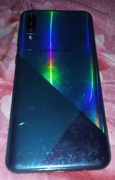 большой экран: Samsung Galaxy A30s, цвет - Зеленый, 2 SIM — 1