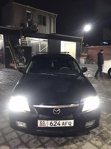 bmw e34 1995: Mazda Familia: 2001 г., Универсал — 1