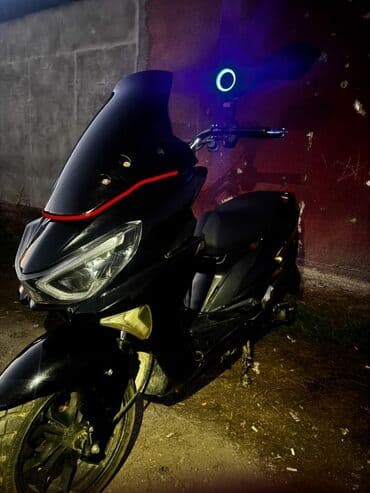 мотоциклы электронные: Скутер/макси-скутер в спортивном стиле, черный цвет. Особенности и — 1