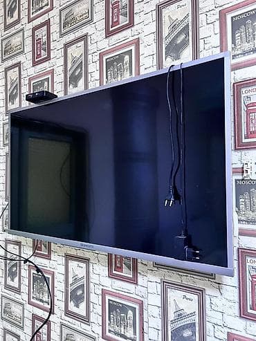 ТВ и видео: Телевизор Skyworth, диагональ около 43–50". Тонкая серебристая рамка — 1