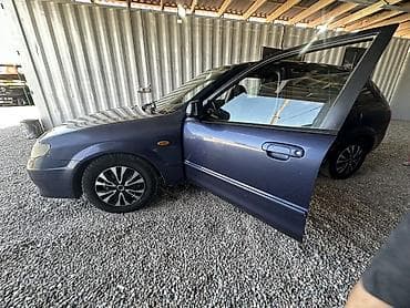 Унаа сатуу: Mazda 323: 2002 г., 2 л, Кол менен иштөөчү, Бензин, Хетчбек — 3