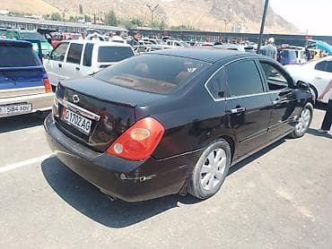 corolla s: Nissan Teana I (J31), черный седан бизнес-класса. Основные — 2