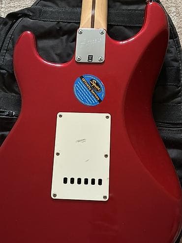 Музыкальные инструменты: - Электрогитара Squier by Fender в стиле Stratocaster, цвет Candy — 6