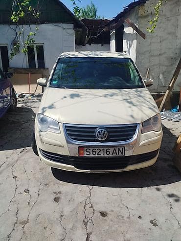 для такси авто: Volkswagen Touran: 2010 г., 1.9 л, Автомат, Дизель, Минивэн — 2