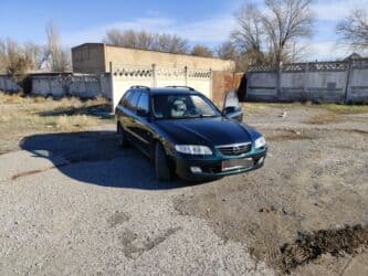 диски железные r14: Mazda 626: 2002 г., 2 л, Механика, Бензин, Универсал — 1