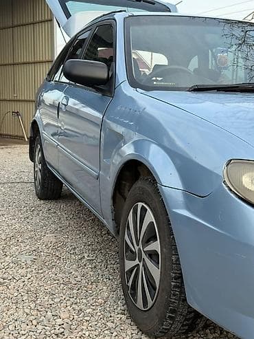 крыло милениум: Mazda Familia: 2001 г., 1.6 л, Автомат, Бензин, Универсал — 6