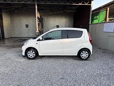 byd e1: Daihatsu Cuore: 2009 г., 1 л, Автомат, Бензин, Хэтчбэк — 4