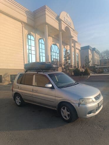 домкрат гидравлический для вытяжки авто: Mazda Demio: 2001 г., 1.3 л, Автомат, Бензин — 5