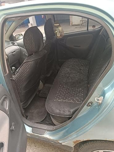 авто выхлоп: Toyota Echo: 2000 г., 1.5 л, Механика, Бензин, Седан — 8