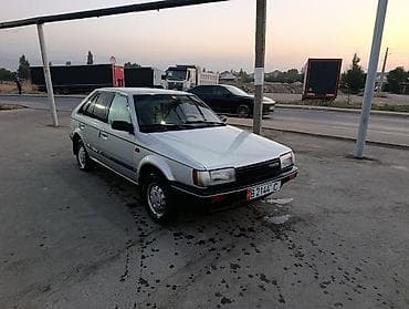 уаз hunter: Mazda 323: 1985 г., 1.5 л, Механика, Бензин, Хэтчбэк — 7