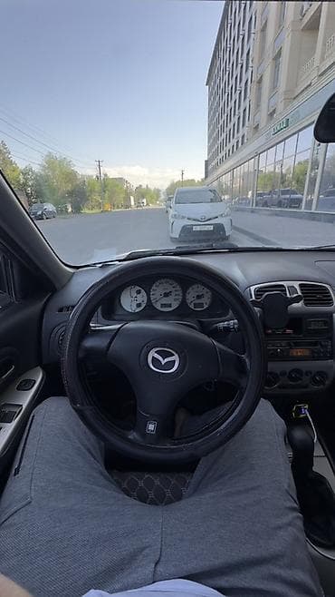 mini kooper: Mazda 323: 2001 г., 1.6 л, Ручные, Бензин, Хэтчбэк — 10