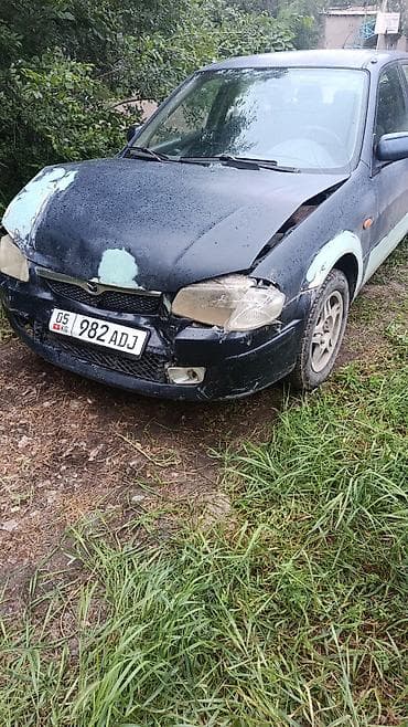 гранат мазда 323: Mazda 323: 1999 г., Седан — 2