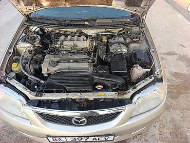 gs300 160: Mazda 323: 2002 г., 1.5 л, Механика, Бензин, Универсал — 4
