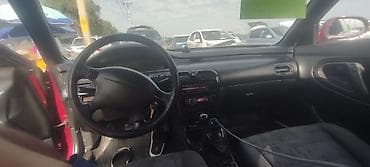 ravon spark: Mazda Cronos: 1996 г., 2 л, Механика, Бензин, Хэтчбэк — 4