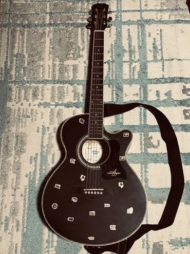 Аккордеоны: Акустическая гитара с вырезом (cutaway), черного цвета. Особенности — 1