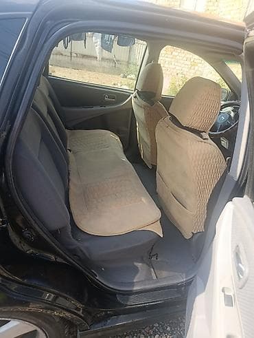 салон машина: Nissan Almera Tino: 2003 г., 1.8 л, Механика, Бензин, Хэтчбэк — 5
