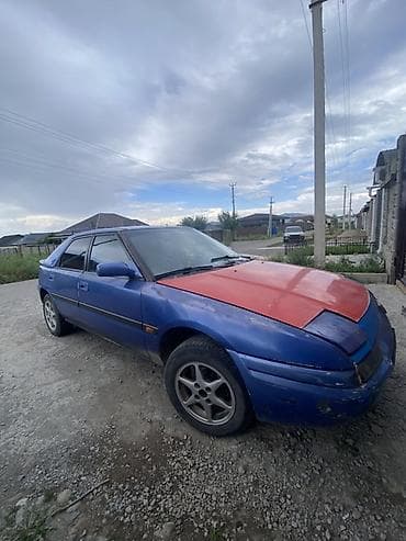 ош жапалак: Mazda 323: 2026 г., Кол менен иштөөчү, Бензин, Хетчбек — 3