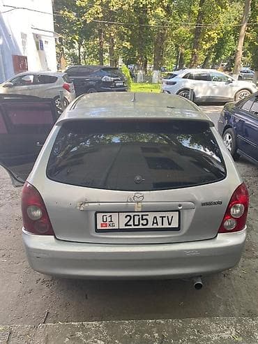 кочкор авто: Mazda Familia: 2003 г., Хетчбек — 4