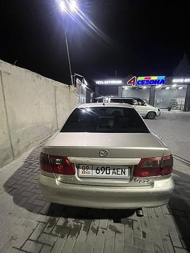 Mazda 626: 2001 г., Механика, Седан — 4