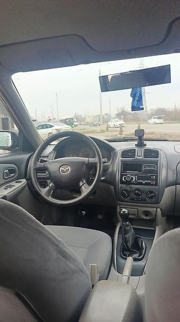 matiz 2009: Mazda 323: 2003 г., 1.3 л, Механика, Бензин, Хэтчбэк — 5